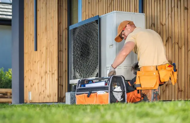 Technician performing emergency HVAC repair
