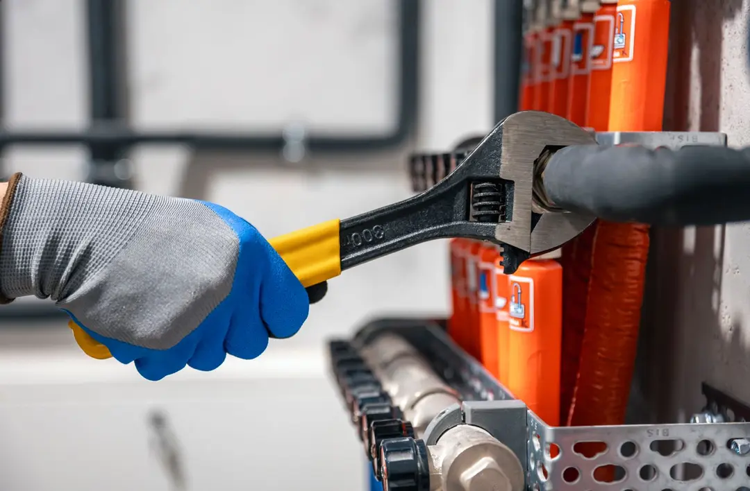 Hand tightening a connection with a wrench